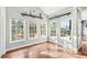 Bright sun room with hardwood floors and plenty of windows for natural light at 160 Deer Cliff Cv, Lawrenceville, GA 30043