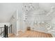 Bright walk-in closet with ample hanging space, shelving, and a chandelier at 160 Deer Cliff Cv, Lawrenceville, GA 30043