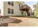 Back of house featuring an upper deck with stairs and a walkout basement at 2845 White Blossom Ln, Suwanee, GA 30024