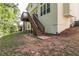 View of the back of the house featuring an upper deck and stairs at 2845 White Blossom Ln, Suwanee, GA 30024