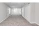 Open carpeted space with gray walls, double closets, and neutral carpet at 2845 White Blossom Ln, Suwanee, GA 30024