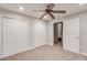 Spacious bedroom with ceiling fan, closet, carpet, and access to closet at 2845 White Blossom Ln, Suwanee, GA 30024
