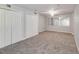 Spacious carpeted bedroom featuring a ceiling fan and mirrored walls at 2845 White Blossom Ln, Suwanee, GA 30024