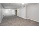 Open bedroom/flex space with gray walls, neutral carpet, and double closets at 2845 White Blossom Ln, Suwanee, GA 30024