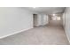 Large carpeted bonus room featuring a ceiling fan and natural light at 2845 White Blossom Ln, Suwanee, GA 30024