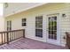 Back of house with wooden deck and access to the backyard at 2845 White Blossom Ln, Suwanee, GA 30024