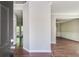 View of the home's entryway with wood floors, leading to the dining and living areas at 2845 White Blossom Ln, Suwanee, GA 30024