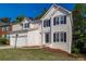Attractive two-story home with a well-maintained front yard and a convenient two-car garage at 2845 White Blossom Ln, Suwanee, GA 30024