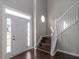 Welcoming foyer with a staircase, natural light, and modern finishes, creating a grand entrance at 2845 White Blossom Ln, Suwanee, GA 30024