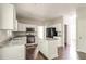 Charming kitchen with island, granite countertops, and stainless steel appliances at 2845 White Blossom Ln, Suwanee, GA 30024