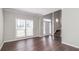 Bright living room showcasing hardwood floors, natural light, and neutral paint throughout at 2845 White Blossom Ln, Suwanee, GA 30024