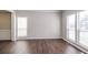 Spacious living area showcasing hardwood floors and a beautiful window bringing in lots of light at 2845 White Blossom Ln, Suwanee, GA 30024