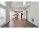 Open floor plan with hardwood floors, and a view to the kitchen at 2845 White Blossom Ln, Suwanee, GA 30024