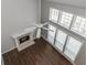 Living room area with a fireplace and large windows at 2845 White Blossom Ln, Suwanee, GA 30024