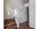 Elegant staircase with wood steps and white railings, showcasing the home's interior design at 2845 White Blossom Ln, Suwanee, GA 30024