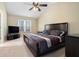 Large main bedroom features a ceiling fan and neutral carpet at 3259 Sentinel Cir, Lawrenceville, GA 30043