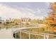Scenic pond and boardwalk create a peaceful environment with colorful trees and architecture in the background at 567 Ponce De Leon Ne Ave # 502, Atlanta, GA 30308