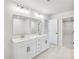 Bright bathroom featuring double sink vanity, granite countertops, and modern finishes at 5711 Tillman Way, Powder Springs, GA 30127