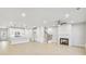 Open concept living area with fireplace, kitchen, stairs, and hardwood floors at 5711 Tillman Way, Powder Springs, GA 30127