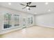 Large bright living area, hardwood floors, and windows with a view to the outside at 5711 Tillman Way, Powder Springs, GA 30127