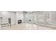 Spacious living room with fireplace, hardwood floors, and plenty of natural light at 5711 Tillman Way, Powder Springs, GA 30127