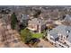 Aerial view of a property showcasing its backyard with a deck, complemented by lush landscaping at 1021 Windermere Xing, Cumming, GA 30041