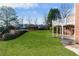 Expansive backyard featuring a lush green lawn and a charming deck, perfect for outdoor entertaining at 1021 Windermere Xing, Cumming, GA 30041