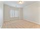 Bright, spacious bedroom features neutral carpet and plantation shutters for natural light control at 1021 Windermere Xing, Cumming, GA 30041