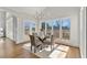 Bright breakfast nook with views and modern chandelier at 1021 Windermere Xing, Cumming, GA 30041