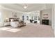 Expansive main bedroom with tray ceiling, large windows and sitting area at 1021 Windermere Xing, Cumming, GA 30041