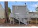 Back of house showing wood deck with stairs leading to yard at 3188 Kingswood Gln, Decatur, GA 30034