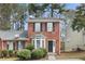 Charming brick two-story home with well-maintained landscaping and black shutters at 3188 Kingswood Gln, Decatur, GA 30034