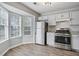 Modern kitchen with stainless steel appliances, granite countertops, and abundant natural light at 3188 Kingswood Gln, Decatur, GA 30034