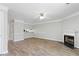 Open living space with wood floors, fireplace, and a glimpse into the modern kitchen at 3188 Kingswood Gln, Decatur, GA 30034