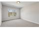 Empty bedroom with gray carpet and a window at 478 Majestic Oaks Pl, Smyrna, GA 30082