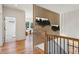 Hallway featuring a decorative wood slat wall with planters and a view into the bright living room at 478 Majestic Oaks Pl, Smyrna, GA 30082