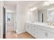 Bright bathroom with double vanity, quartz counters, and modern fixtures at 4793 Moonstone Trce, Kennesaw, GA 30144