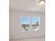 Bright bedroom with carpet, a ceiling fan, and a view of the street at 4793 Moonstone Trce, Kennesaw, GA 30144