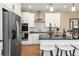 Bright kitchen with stainless steel appliances, white cabinets, and a functional island with seating at 4793 Moonstone Trce, Kennesaw, GA 30144
