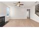 Bright and airy living room with a fireplace, wood floors, large window with lots of natural light, and neutral colors at 4793 Moonstone Trce, Kennesaw, GA 30144