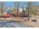 Community playground with colorful equipment for outdoor activities at 305 Hembree Grove Trce, Roswell, GA 30076