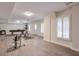 Spacious recreation room with gray vinyl floors, recessed lighting, and natural light at 305 Hembree Grove Trce, Roswell, GA 30076