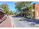 Charming street view with boutiques, restaurants, and tree-lined sidewalks, enhancing the neighborhood's appeal at 305 Hembree Grove Trce, Roswell, GA 30076