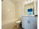 Clean bathroom features a bathtub with tiled walls, toilet and vanity at 3187 Moor View Rd # 37, Duluth, GA 30096