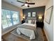 Modern bedroom with gray accent wall and natural light at 3187 Moor View Rd # 37, Duluth, GA 30096