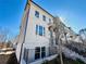 View of the townhome exterior featuring a painted brick facade at 3187 Moor View Rd # 37, Duluth, GA 30096