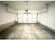 Empty two-car garage with painted walls and concrete floor at 3187 Moor View Rd # 37, Duluth, GA 30096