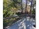 View of the home's back deck, showing grey-stained wood and backyard landscaping at 3980 Bayside Cir, Atlanta, GA 30340