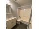 Bathroom featuring a shower-tub combo and single sink vanity at 3980 Bayside Cir, Atlanta, GA 30340