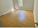 Bright bedroom with neutral walls and wood-look floors at 3980 Bayside Cir, Atlanta, GA 30340